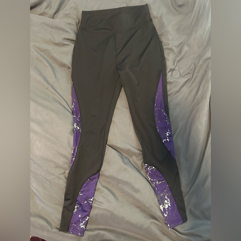 Size medium pop fit black leggings with purple/white design on sides & pockets.